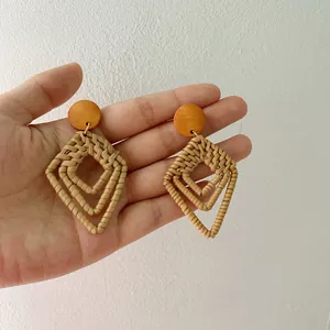 Handmade bohemian rattan earrings with geometric diamond pendants and natural wood tops