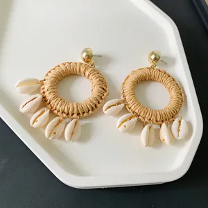 Bohemian woven straw hoop earrings with natural shell pendants and golden ball studs