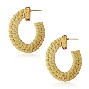 Handmade Bohemian C-shaped rattan woven hoop earrings with hammered gold metal studs