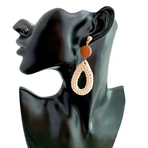 Bohemian handmade woven teardrop earrings with beige rattan and brown round wood studs