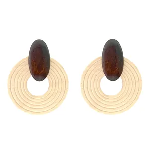 Bohemian style large round wooden earrings with geometric textures on white background