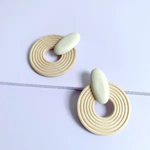 Exaggerated geometric large round wooden earrings with beige and sage green accents