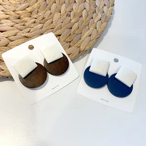 Retro geometric wood earrings in coffee and navy blue with white square accent studs