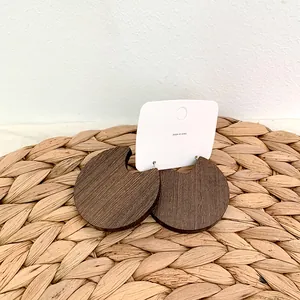 Minimalist round dark brown wood hoop earrings with geometric U-shape notch design