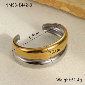 Detail view of two-tone gold and silver irregular hammered stainless steel cuff bracelet