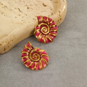 Nautilus shell stud earrings in 18K gold plated stainless steel with pink enamel finish