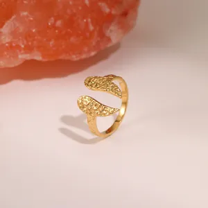 Adjustable golden titanium steel open ring with unique hammered texture and wing design