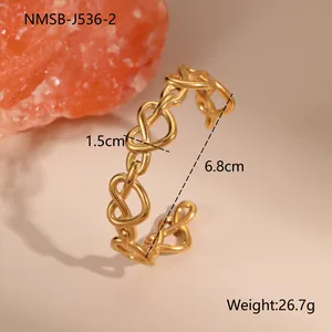 Detail view of 18K gold plated open bangle showing 1.5cm heart link and 6.8cm diameter