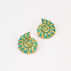 Detail of nautical conch earrings with green enamel and 18K gold-plated stainless steel