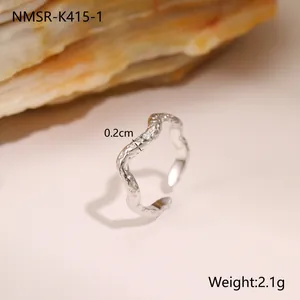 Macro view of geometric hammered texture on silver titanium steel ring with 0.2cm width