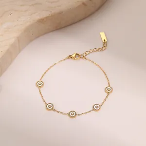 18K vergulde roestvrijstalen armband met witte emaille cirkels en fijne schakelketting