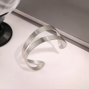 Fashionable hollow wave layered stainless steel open cuff bracelet in polished silver finish