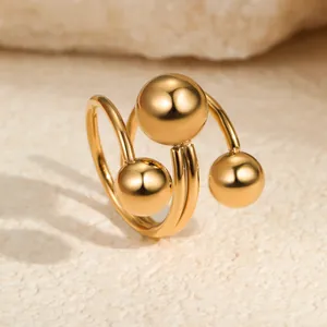 Minimalist gold-plated stainless steel triple spiral open ring with three spheres