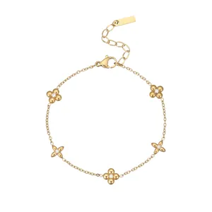 18k gold plated titanium steel bracelet with flower charms and zircon stone accents