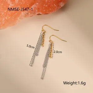 Macro detail of two-tone gold and silver chain tassel earrings showing 5cm length
