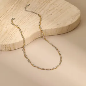 Detail of two-tone double layer necklace with gold bead chain and silver paperclip links
