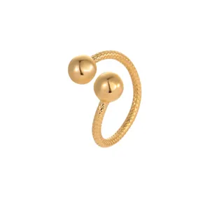 Adjustable titanium steel open ring with two polished golden spheres and textured band