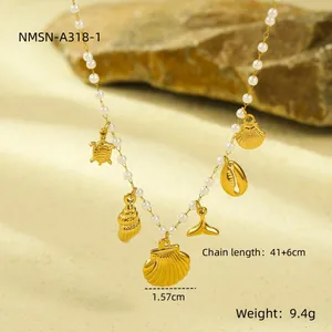 Baroque pearl necklace with gold sea life charms including turtle and whale tail