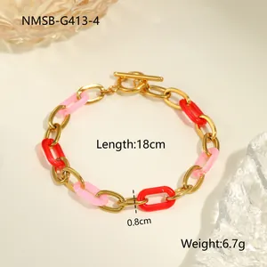 Bracelet tendance en acier doré avec maillons en résine rouge et fermoir à bascule OT