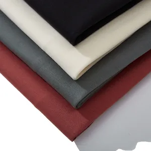 Stack of heavyweight 230g cotton t-shirts in black, cream, charcoal, and burgundy colors
