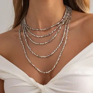 Elegant minimalist multi-layer silver square bead necklace in a classic old money style