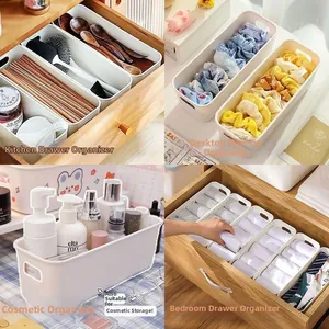 Macro view of white rectangular storage boxes with handles for drawer organization