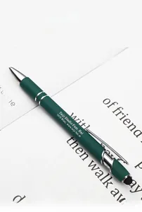 Macro detail of dark green metal stylus ballpoint pen with custom engraved text and silver clip