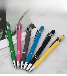 Close-up of colorful metal stylus pens with touch tips and silver rings on marble