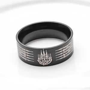 Polished black stainless steel ring with Thai Buddhist scriptures and silver carvings