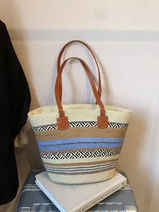 Retro woven tote bag with colorful stripes and brown leather handles for travel