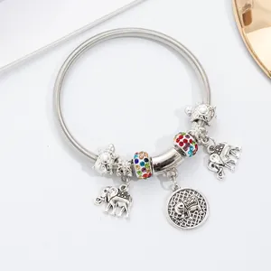 Detail of silver snake chain bracelet with elephant charms and colorful crystal beads