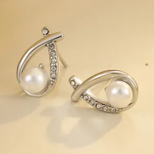 Elegant silver cross earrings with shimmering pearls and sparkling cubic zirconia stones