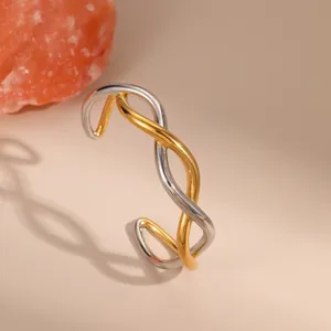 Two-tone intertwined stainless steel open bangle in polished 18K gold and silver finish