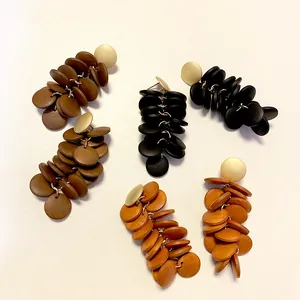 Long vintage tassel earrings with wooden geometric circles in brown, black and orange