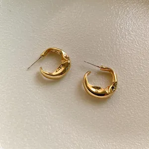 Gold irregular wavy earrings with S925 silver needles and high-polish metallic finish