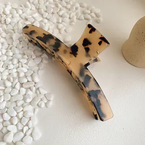 Large tortoiseshell acetate hair claw clip for women in a minimalist elegant style
