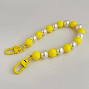 Colorful candy-style beaded phone strap with yellow matte beads and white pearls