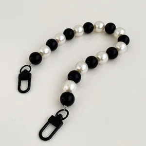 Minimalist black and white bead chain accessory with dual metal lobster clasps