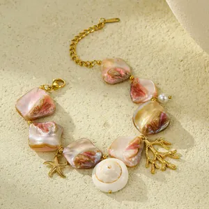 Ocean themed stainless steel charm bracelet with shell, starfish, and coral pendants