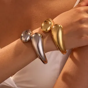 Minimalist 18K gold and silver plated chunky open bangle with artistic droplet design