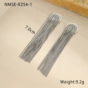 Macro detail of long silver tassel earrings showing 7.0cm length and 9.2g weight specs