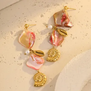 Bohemian pink tassel earrings with golden seashells and pearl details for beach vacation