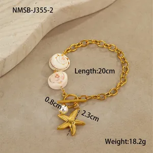 Detailed shot of golden star necklace with white sea shells and round pearl pendant