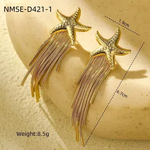 Detail view of gold starfish tassel earrings with length and weight measurements