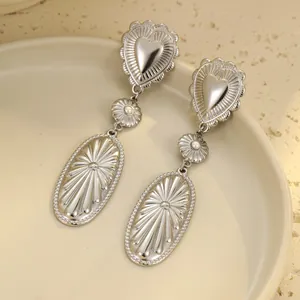 Silver stainless steel heart tassel earrings with oval sunburst relief and pearls