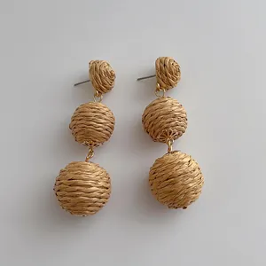 Handmade raffia triple ball drop earrings with natural straw weaving for summer beach style