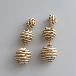 Handmade raffia ball drop earrings with three-tier bohemian woven design for summer beach wear