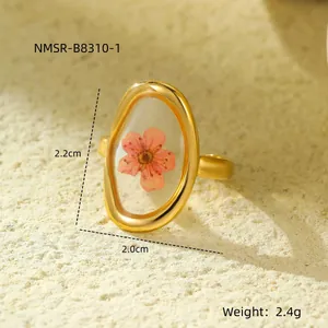 Vintage gold oval stainless steel ring featuring a real pink dried flower in resin