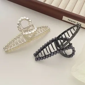 Elegante haarspelden set met kattenoogstenen op zilveren en zwarte metalen bases