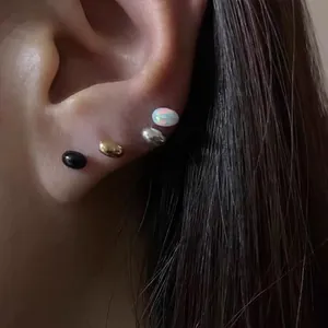 Minimalist bean-shaped stud earrings in gold silver and black with colorful opal inlay